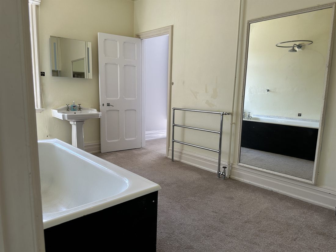 Victorian bathroom with panelled bath and pedestal basin